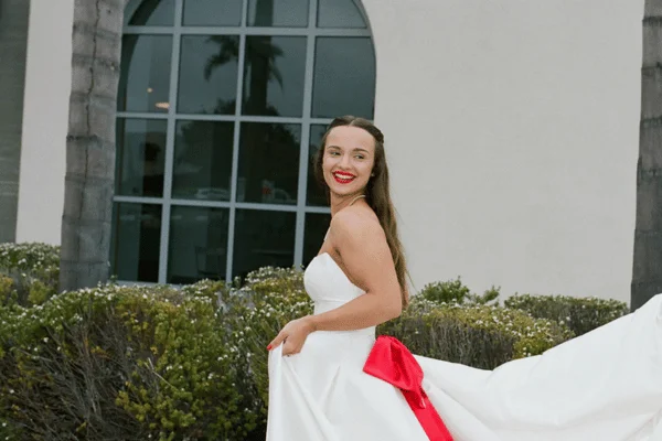 Bride wearing polished rehearsal dinner hair and makeup
